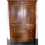 Victorian mahogany linen press, with flame cut doors, opening to reveal five linen drawers,