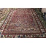 Zeigler style carpet with all-over floral design, over deep red ground group border (worn),