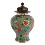 19th century Chinese famille verte jar and pierced and carved wooden cover,
