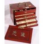 Early 20th century Chinese brass bound wooden mah jongg chest with sliding door,