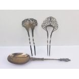 Silver spoon of Dutch style with figure terminal 1875 and late Victorian silver hair ornaments with