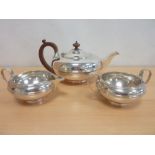 Silver three piece tea set of early 19th century compressed spherical shape with reeded girdle,