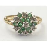 Cluster ring with small emeralds and diamonds in 9ct gold. Size 'Q½'.