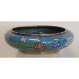 Chinese cloisonne circular shallow bowl with floral decoration on turquoise ground.