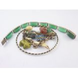 Silver bracelet with an enamel basket with Moses and various other charms,