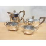 Silver four piece tea set of Art Deco rounded rectangular shape with embossed angular corners,