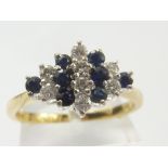 Sapphire and diamond ring with with alternate rows in 18ct gold, size 'N'.