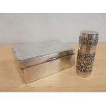 Indian silver embossed cylindrical box with pull-off cover by Dass & Dutt also a cigarette box. (2).