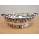 Silver circular fruit bowl with fruiting vine handles and border, 1936, 23.5cm, 29 oz.