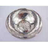 Silver hammered bowl with embossed trefoils by Keswick School of Industrial Art,