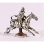 Chromed white metal car mascot in the form of horse and huntsman,