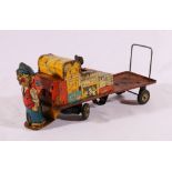 British tinplate clockwork platform luggage trolley with driver wearing BR (British Rail) cap,