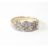 Diamond triple cluster ring in 9ct gold, size P.