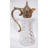 Hobnail-cut glass claret jug of tapering shape with engraved mount and scroll handle,