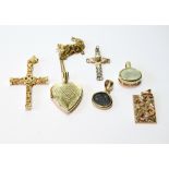 Gold heart locket, a cross, a coloured pendant, another with ancient coin, and two others,