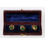 Set of three 19th century gilt metal buttons with green paste, cased.