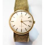 Gent's Omega 9ct gold bracelet watch, 1977, 55g gross. Condition Report Going.