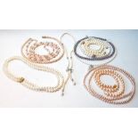 Ten pearl necklets, various hues, some on gold snaps, '9c'.