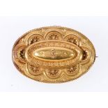 Victorian gold oval brooch with locket, 15ct.