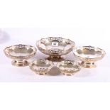 Set of five graduated silver circular bowls with pierced shaped edges on collet feet 19cm, 15cm (2),