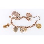 9ct gold hollow curb bracelet with six gold and other charms.