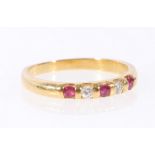 Diamond and ruby ring of half hoop style, channel set in 18ct gold, size O.