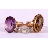 9ct gold amethyst dress ring size R, 5.2g. 9ct gold brown quartz dress ring size M, 4.