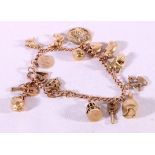 9ct gold charm bracelet with 18 dependant charms some stamped 9ct and 375, 28.8g.