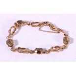 9ct gold bracelet set with brown quartz stones 10.2g.