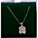 18ct white gold diamond and pink stone set pendant fine trace chain, 3.75g gross.