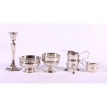 Two silver sugar bowls, a silver cream jug, a silver sauceboat and a silver candlestick (5).