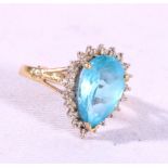 9ct gold dress ring set with faceted aquamarine stone encircled by diamonds, size N,4g.