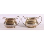 George VI silver sugar bowl and cream jug with feathered rim, Sheffield 1946,