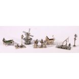 Seven Dutch silver and white metal miniature models including pram, windmill, billiards, band, etc.