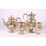 Edwardian silver four piece tea set decorated with vignettes, Glasgow 1902,