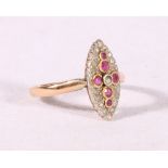 Unhallmarked yellow gold ruby and diamond ring with navette shaped setting, size N, 2.3g.