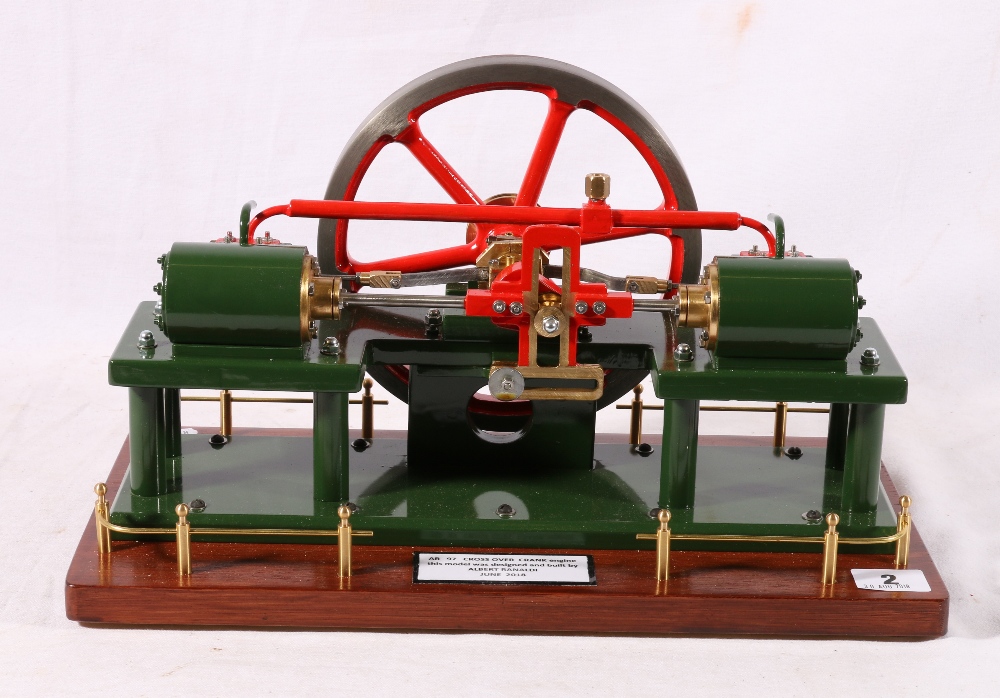 Model cross over engine built by Albert Ranaldi, 36 cm long raised on a wooden plinth.