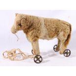 Early 20th century Mohair and leather Child's pull along toy modelled as a cow 35cm long
