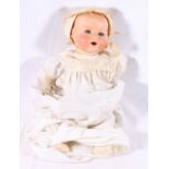 Armand Marseille of Germany bisque head doll, the head stamped 351/9k 57cm tall.