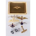 Vogue compact with RAF ensignia and various RAF sweetheart brooches, one silver,