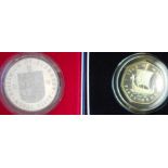 Guernsey. Crown. 1978. Silver Proof. Isle of Man. Fifty pence. 1979. Silver Proof. Both cased.