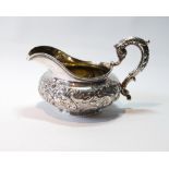 Silver cream jug of compressed form with chased flowers and scrolls, by J. & J. Angell, 1832, 7½oz.