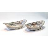 Pair of silver sweetmeat dishes of navette shape, pierced and embossed, by Hamilton & Inches,