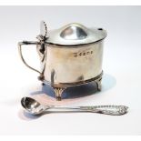 Silver oval mustard pot on fluted feet, Birmingham 1886, liner and an EP spoon.