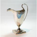 Silver cream jug of Georgian helmet shape with beaded edge and square foot, 1926, 3½oz.