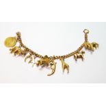 9ct gold curb bracelet with nine charms and a half sovereign dependent, 40g.