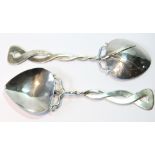 Pair of silver Liberty Arts & Crafts spoons with twisted entwined double stems and almost