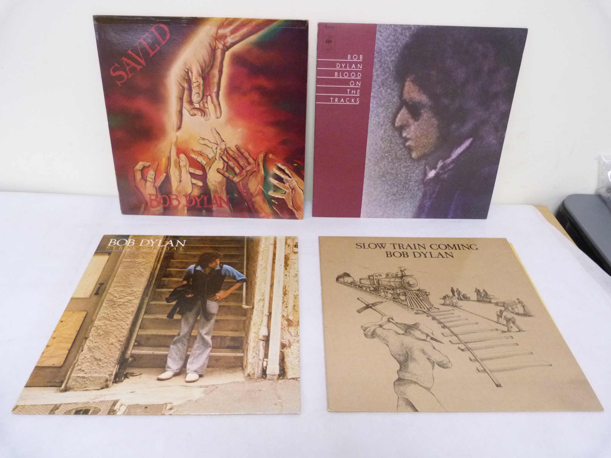 Four Bob Dylan LP's to include Saved, Blood On The Tracks and Street Legal.