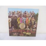 Beatles Sgt Pepper Original UK Mono 1967 with flame inner and original cut-outs.