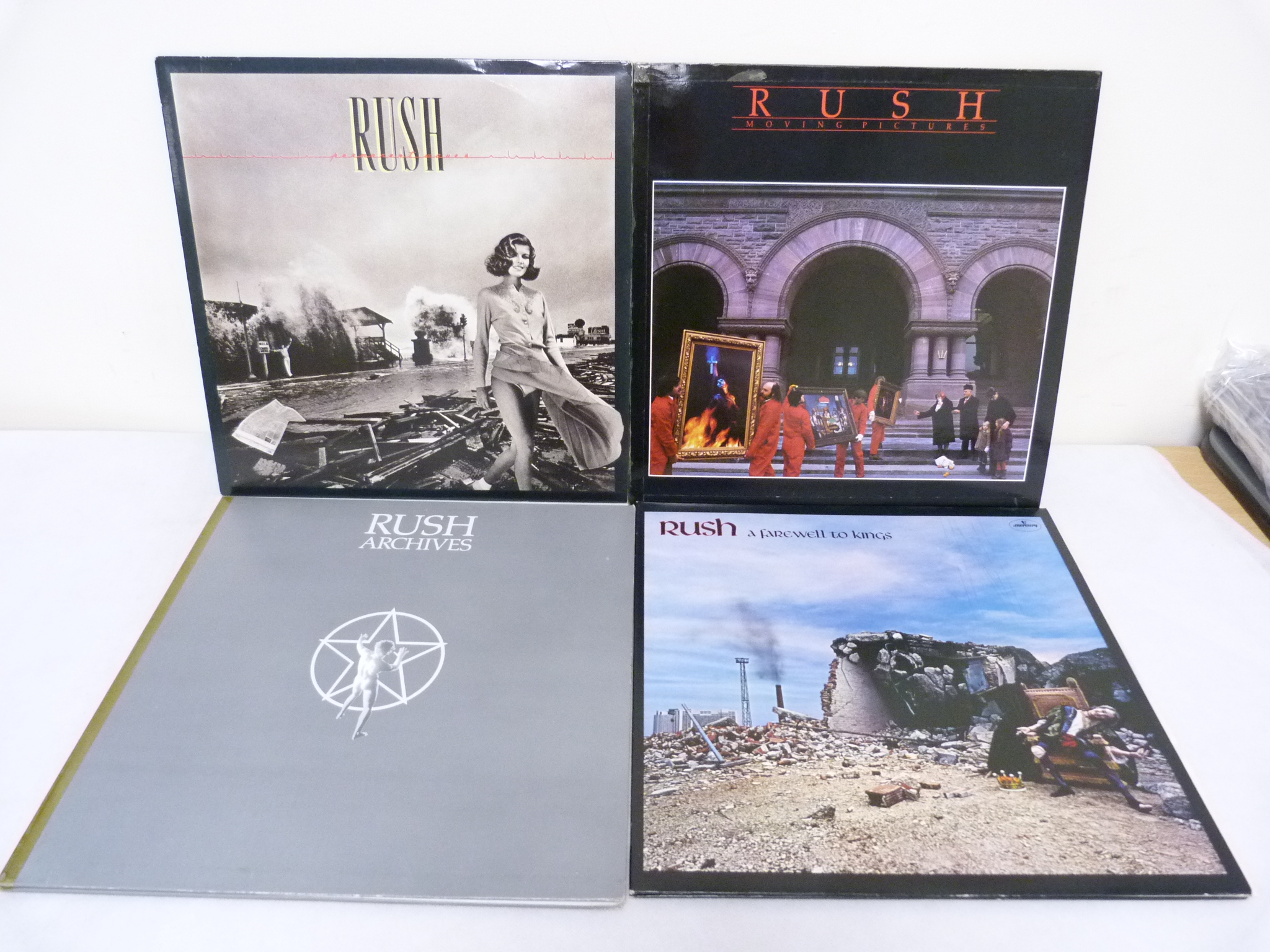 Four UK original Rush LP's to include Permanent Waves and Archives. Condition Report.